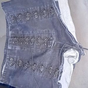 Distressed laced up denim shorts from Fashion Nova